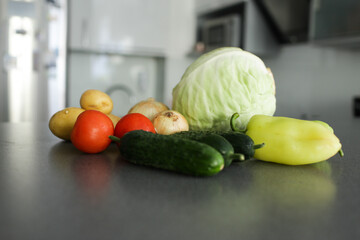 Vegetables are beautifully arranged on the kitchen table