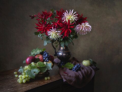 Still life with bouquet of dahlia and fruits