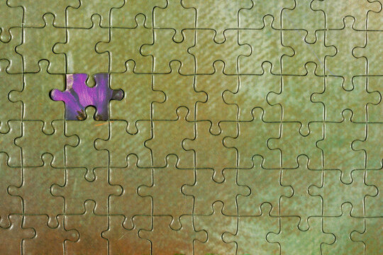 Disassembled puzzle with a last wrong piece impossible to fill
