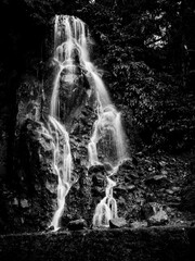 Black and White long exposure picture of Veu da Noiva waterfall, Sao Miguel island, Azores, Portugal
