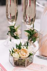 the bride holds a bouquet on the wedding day and exchanges wedding rings with the groom