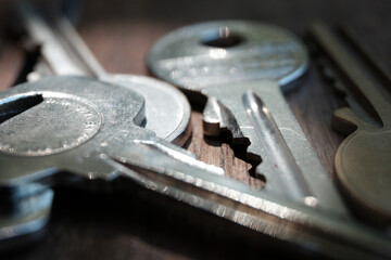 A macro close up of house keys on a wooden table