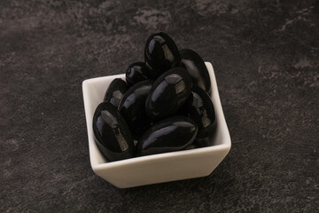 Pickled black olives in the bowl