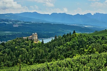 Italy-view towards Cles Castle at the lake of Santa Giustina