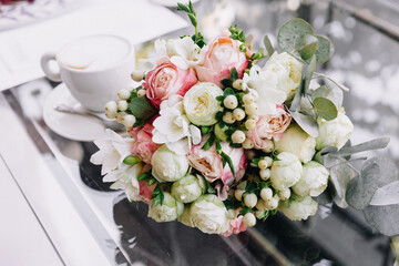 the bride holds a bouquet on the wedding day and exchanges wedding rings with the groom