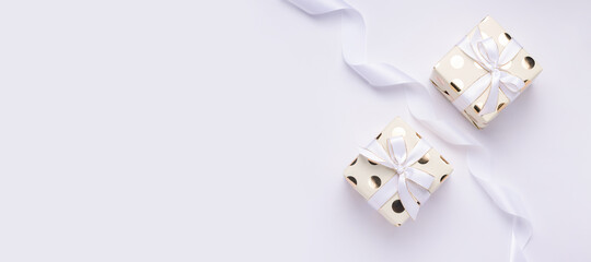 Holiday gift concept. Two packages on a white background. Copy space. Banner