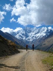 Fototapeta na wymiar Hikers on the Salkantay trek in Peru, with snow capped mountains in the distance