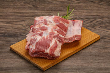 Raw pork ribs served rosemary
