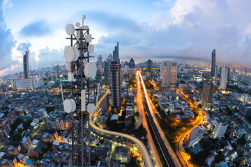 Telecommunication tower with 5G cellular network antenna on nice city background