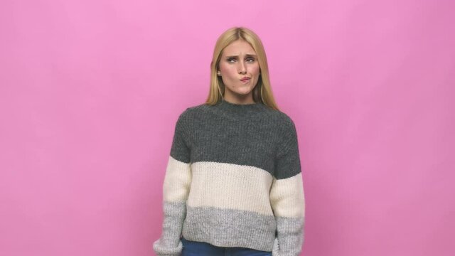 Young caucasian blonde woman confused, feels doubtful and unsure