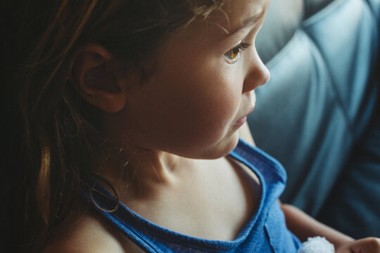 Profile of five year old girl watching television - blank stare