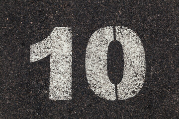 Number 10 Printed on White Over Dirty Asphalt