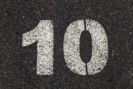 Number 10 Printed on White Over Dirty Asphalt