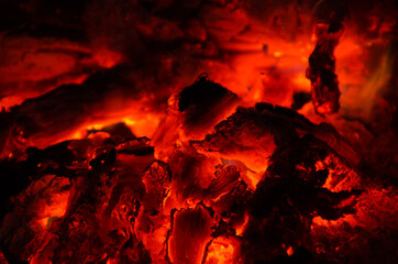embers burn down in a hardwood fire - 380399710
