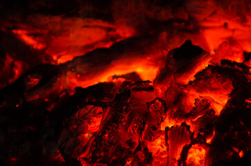 embers burn down in a hardwood fire - 380399904