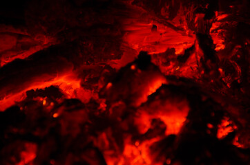 embers burn down in a hardwood fire - 380400762