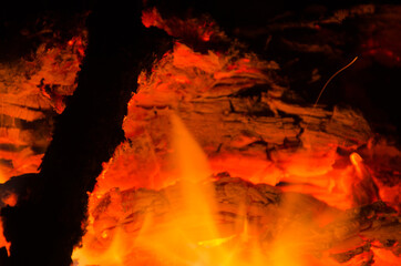 embers burn down in a hardwood fire - 380401579