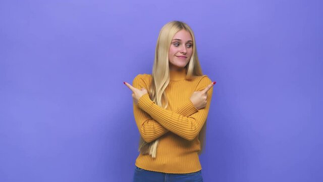 Young caucasian blonde woman points sideways, is trying to choose between two options