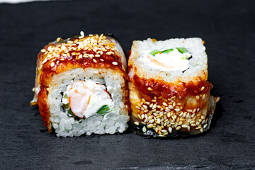sushi rolls on a black background