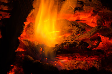Fototapeta premium embers burn down in a hardwood fire