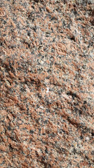 Red granite. Red granite texture. Background with vintage granite surface