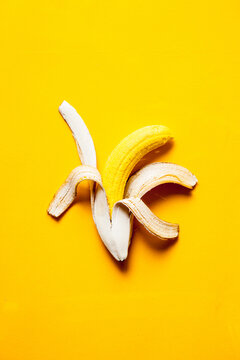 Yellow banana in white skin.