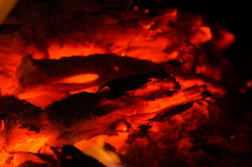 embers burn down in a hardwood fire - 380402951