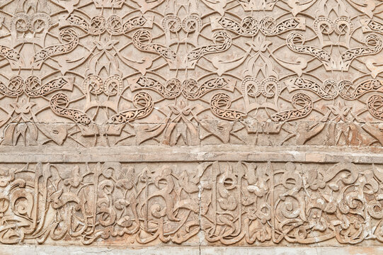 Detail of the walls of Ben Youssef Medersa in Marrakech, Morocco.
