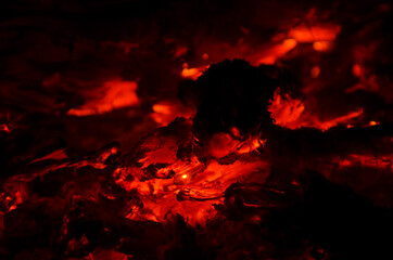 embers burn down in a hardwood fire - 380403784