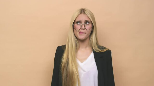 Young caucasian blonde woman confused, feels doubtful and unsure