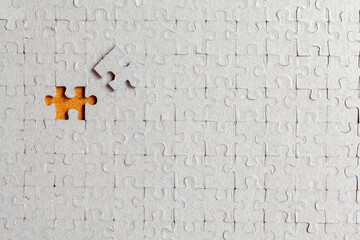 Disassembled puzzle with a last wrong piece impossible to fill