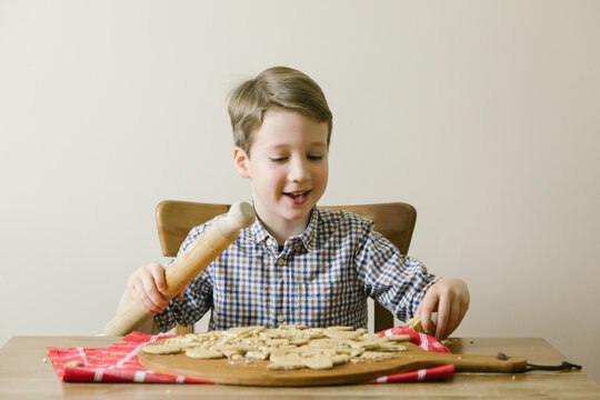 Boy enjoys smashing up biscuits