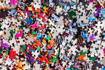 Disassembled puzzle colored pieces