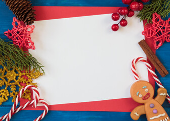 Christmas composition with festive decoration and blank card with copy space. Top view