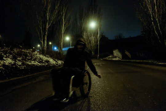 Man on wheelchair on the road