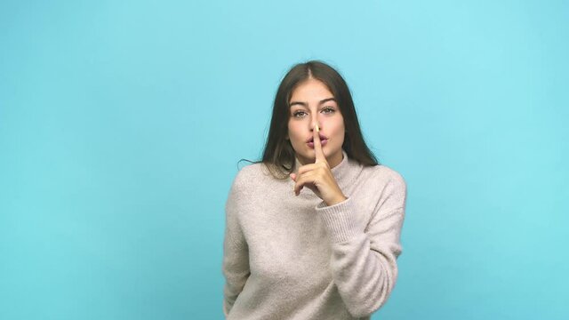 Young caucasian woman keeping a secret or asking for silence