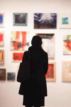 girl the gallery in front of the artwork
