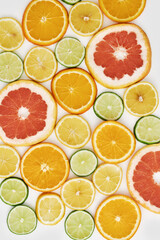 Fototapeta na wymiar Top view of citrus fruits, Orange, tangerine, lemon, lime and grapefruit slices or circles isolated over white background