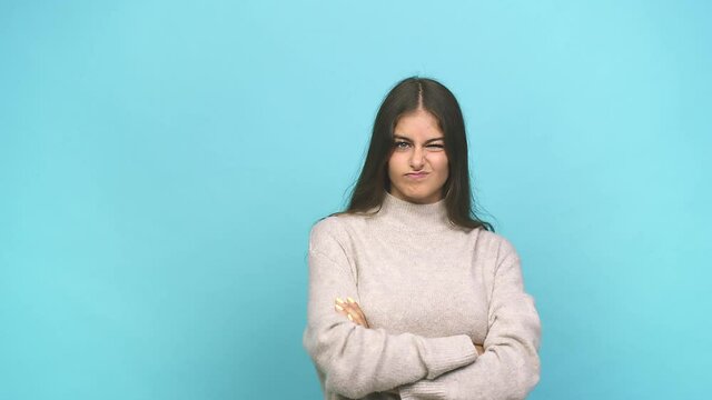Young caucasian woman unhappy looking in camera with sarcastic expression