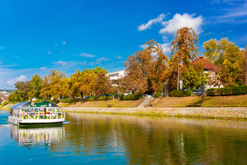 Fototapeta premium Silent river in the autumn small town