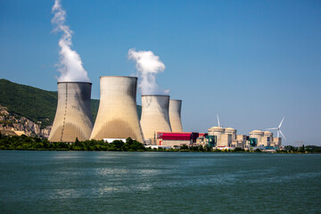 Viviers, France - 6/6/2015: Four Cooling towers, part of a nuclear power plant complex along the...