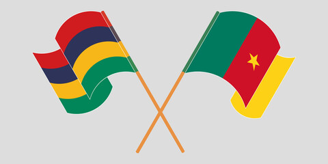 Crossed and waving flags of Cameroon and Mauritius