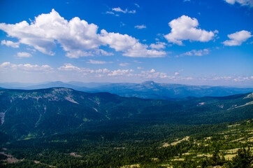 Fototapeta premium View from high mountain. clouds in the sky