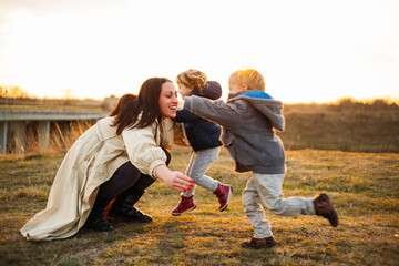 Kids running toward their excited mum