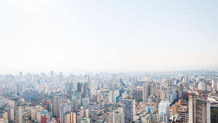 Fototapeta na wymiar Urban aerial panorama of São Paulo in a sunny day with blue sky. View from Copan building.