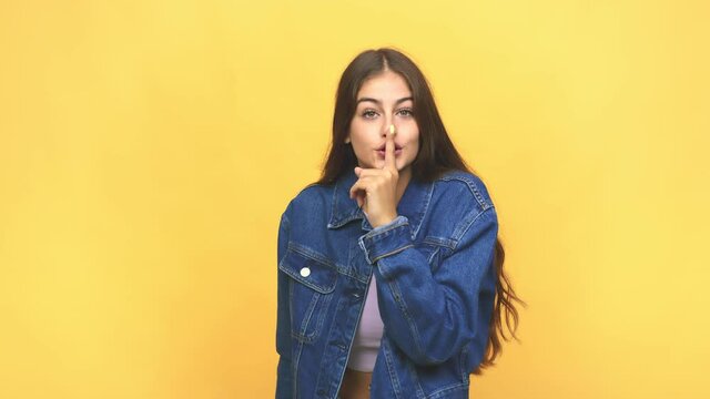 Young caucasian woman keeping a secret or asking for silence