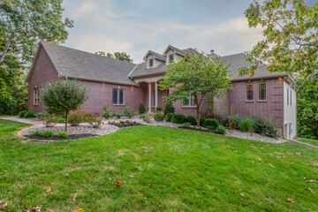 Brick home with woods at dawn