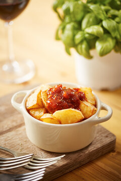 Spicy patatas bravas with herbs tapa