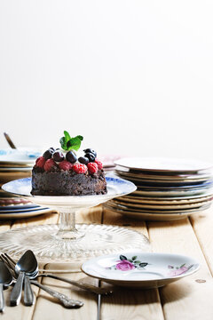 Flourless chocolate pudding with raspberry,blueberry and crÔøΩÔøΩme fraÕåche
