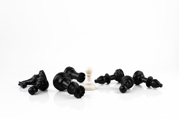 White and black chess. The pawn wins. Leadership, success concept.
